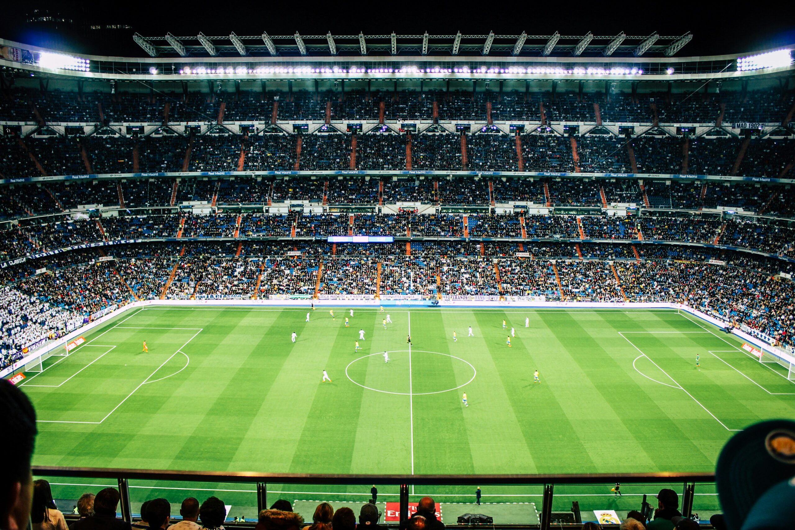 Football stadium filled with cheering fans”